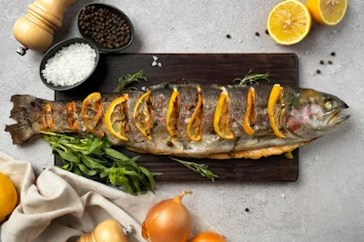 una deliciosa trucha al horno rellena con jamón